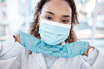 Image showing Portrait, covid and cute with a black woman nurse in the hospital, wearing a mask for health and safety. Face, medical and healthcare with a female medicine professional posing closeup in a clinic