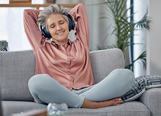 Image showing Relax, music and headphones with old woman on sofa for peace, wellness and streaming. Mobile radio, podcast and technology with lady listening in living room at home for health, happy and zen mindset