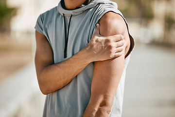 Image showing Arm, mockup and man in street with injury or ache in fitness, sports or cardio on blurred background. Shoulder pain, runner and hands of guy suffering heart attack sign, accident or risk in workout