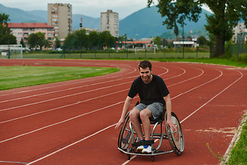 Image showing A person with disability in a wheelchair training tirelessly on the track in preparation for the Paralympic Games