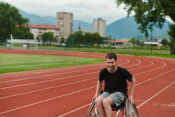 Image showing A person with disability in a wheelchair training tirelessly on the track in preparation for the Paralympic Games