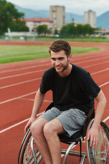 Image showing A person with disability in a wheelchair training tirelessly on the track in preparation for the Paralympic Games