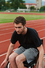 Image showing A person with disability in a wheelchair training tirelessly on the track in preparation for the Paralympic Games