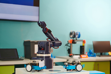 Image showing Modern equipment for robotics and a 3d printer for modeling on a table in a laboratory