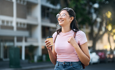 Image showing Travel, coffee and woman walking in a city building with freedom on a urban adventure in Italy. Relax, smile and morning drink of a young person on vacation with happiness and backpack outdoor