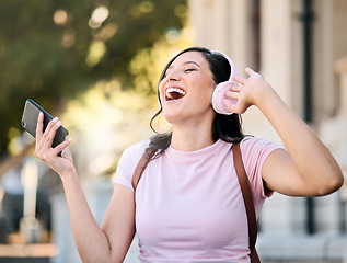 Image showing Music, headphones or dance by woman in city for travel, happy and freedom on building background. Radio, podcast and travelling girl student smile for app, online audio or subscription service