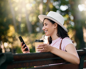 Image showing Happy, search or woman with phone on park bench in morning for social media, networking or reading comic blog. Smile, coffee or girl on 5g smartphone for freedom, web or internet news communication