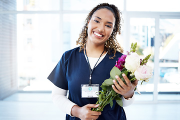 Image showing Success, celebration and portrait of doctor with flowers at a hospital for promotion and gift for work. Care, happy and female nurse with bouquet as a present for commitment in healthcare nursing job