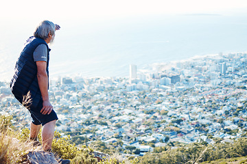 Image showing Hiking, looking and senior man explore a city view for on an adventure, workout and fitness in Cape Town. Training, exercise and elderly person search on a mountain for health and wellness