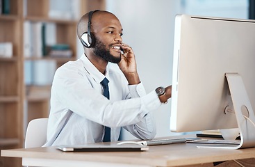 Image showing Call center, black man and consultant call of a crm, contact us and telemarketing employee. Businessman, web help and computer communication of an online consulting agent working on customer service