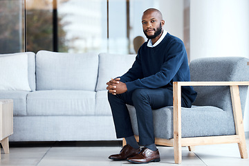 Image showing Psychologist, waiting and black man sitting on chair at work, job or modern workplace in modern office lounge. Portrait, employee and African American businessman or therapist with positive mindset