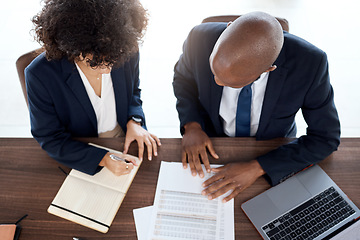 Image showing Lawyer, consulting and documents with a business team working on a desk in an office from above. Contract, meeting or financial advisor with a man and woman employee at work in collaboration