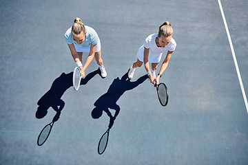 Image showing Woman, tennis and friends in team match, game or sports together standing ready above on the court. Women in fitness sport, competition or club with racket stance for teamwork, exercise or training