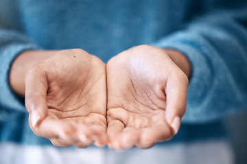 Image showing Hands open, charity and support with a woman begging for help in studio closeup for humanity to share. Community, poverty and donation with female palms asking for aid, compassion or kindness