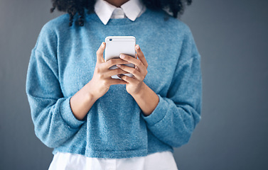 Image showing Phone, hands or black woman search in studio for social media content, networking or reading blog post update. Website, startup or girl with smartphone for communication, internet news or mobile app