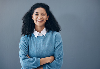 Image showing Portrait, fashion and style by black woman smile, excited and happy isolated against a studio gray background. Female, confident and person arms crossed with mockup space and positive mindset