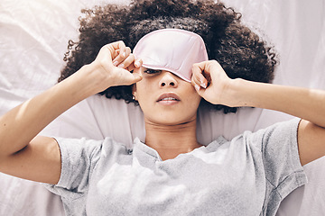 Image showing Sleep, relax and black woman with eye mask waking up, dream and refresh body and mind in apartment or hotel. Dreaming, rest and relaxation, tired girl sleeping late on weekend morning in cozy bedroom