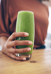 Image showing Hand, glass and smoothie with a black woman holding a health beverage for a weight loss diet or nutrition. Wellness, detox or drink with a healthy female enjoying a fresh fruit and mint juice