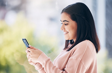 Image showing Happy woman, phone or window typing in house, home or apartment on social media or internet dating website. Smile, texting or relax student on mobile technology, news blog or mockup communication app