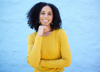 Image showing Portrait, proud and black woman in studio on mockup, space and blue background for advertising. Face, smile and girl relax on backdrop, cheerful and confident, cool and posing inside on copy space