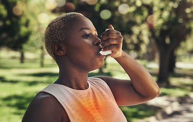 Image showing Nature, fitness and woman with asthma pump after an intense running workout or training in park. Healthcare, sports inhaler and African female with respiratory problem after cardio exercise in field.