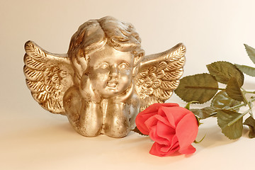 Image showing Cupid with rose