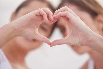 Image showing Heart hands, couple of friends and women outdoor with blurred background showing teamwork. Love, care and support hearts emoji hand sign of lgbt pride and solidarity together for valentines day