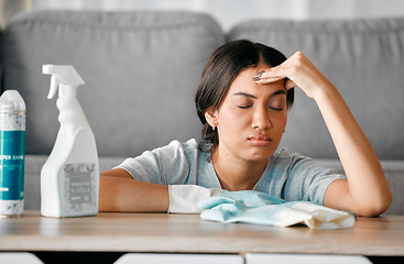 Image showing Headache, cleaning stress and tired black woman cleaner feeling burnout from housekeeping. Home, dust cloth and fatigue of house worker with hygiene products for furniture in a living room lounge