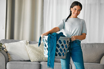 Image showing Laundry, clothes and portrait of woman with basket for cleaning, housekeeping and maintenance at home. Housework, washing and happy girl in living room carry container for linen, fabric and material