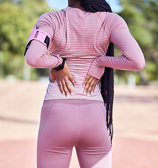 Image showing Back stretching, pain and black woman outdoor for fitness, runner training and workout. Running athlete, run stretch and sport start of a young person with blurred background resting before sports