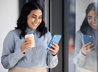 Image showing Smile, woman with phone in office on coffee break, browsing social media, surfing internet or typing message. Technology, communication and happy businesswoman standing in lobby reading on smartphone