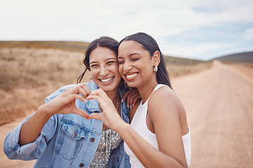 Image showing Friendship, heart shape and women in nature on a holiday, adventure or weekend trip together. Happy, smile and female best friends with love hand gesture, sign or emoji on vacation in the countryside