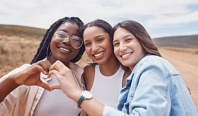 Image showing Love, portrait and women with heart hands for travel, bonding and friendship in the countryside. Happy, together and friends with emoji sign to share loving energy on an adventure in the desert