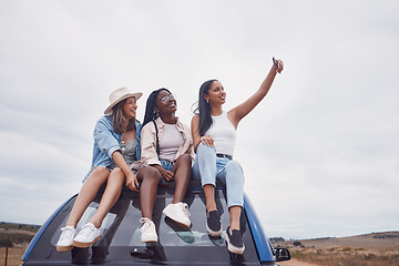 Image showing Road trip selfie of women friends on car roof with sky mockup for social media, group travel and vacation. Profile picture of diversity youth or people in Africa safari, desert or countryside journey