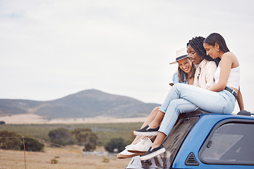 Image showing Road trip, car and happy friends with phone, social media update and countryside adventure on sky mockup space. Youth, gen z and diversity women on 5g smartphone and roof for travel journey together