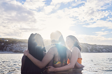 Image showing Back, friends and women in ocean, happiness and summer break for fun, relax and joyful together. Support, females or ladies with smile, seaside vacation or holiday for reunion, celebration or bonding