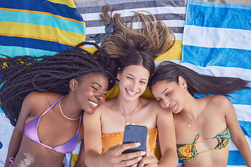 Image showing Beach selfie, girl friends and happiness by the sea lying on a towel feeling freedom with a smile. Summer, students and girls in Miami taking profile picture for social media in summer at ocean