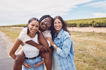 Image showing Portrait, friends and piggyback of women on holiday, vacation or trip outdoors. Group freedom, comic adventure and happy girls laughing at joke, having fun or enjoying quality time together in nature