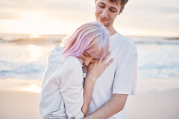 Image showing Love, beach and young couple on date for valentines day, ocean fun and romantic embrace at sunset. Romance, happiness and gen z woman and man hug on tropical valentine holiday in Indonesia in evening