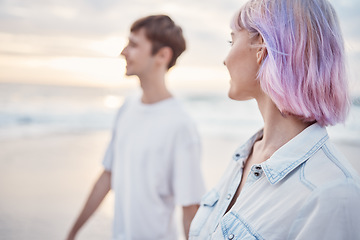 Image showing Gen z couple, beach walk and sea holiday of students on vacation at sunset. Ocean, walking and relax young people together with love, care and support outdoor feeling calm with blurred background