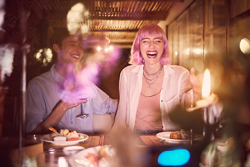 Image showing Happy couple at dinner, celebration at restaurant with fine dining, love and anniversary with young people laughing. Funny, happiness and eating, care in relationship with commitment and partnership