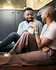 Image showing Conversation, happy and African couple with coffee for peace, love and care on the kitchen floor. Communication, smile and black man and woman drinking tea while talking about their relationship