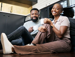 Image showing Relax, smile and portrait of a couple with coffee on the kitchen floor in the morning. Love, happy and black man and woman drinking a cup of tea, latte or warm beverage with conversation together