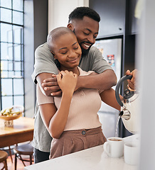 Image showing Morning, hug and African couple making coffee for energy, drink and routine in the kitchen. Smile, affection and black man and woman hugging while preparing tea, bonding and relaxing in their home