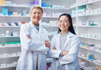 Image showing Portrait, women teamwork and pharmacists with arms crossed in pharmacy, drugstore or shop. Healthcare, medication store and happy, proud or confident medical doctors, senior woman and Asian female.