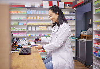 Image showing Pharmacy, help and asian woman at checkout counter for prescription drugs scanning medicine. Healthcare, pills and pharmacist from Japan with medical product in box and digital scanner in drugstore.