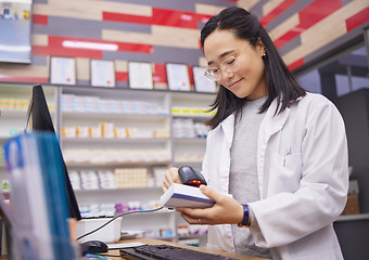 Image showing Pharmacy, smile and asian woman scanning medicine at checkout counter for prescription drugs. Healthcare, pills and pharmacist from Japan with medical product in box and digital scanner in drugstore.