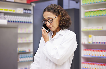 Image showing Phone call, pharmacy and medicine with a woman taking an order in a drugstore for prescription or treatment. Mobile, contact and healthcare with a female pharmacist talking in a hospital dispensary