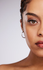 Image showing Beauty, half face and portrait of a woman in a studio with a skincare, natural and facial routine. Cosmetic, makeup and female model with a cosmetics, dermatology or skin treatment by gray background