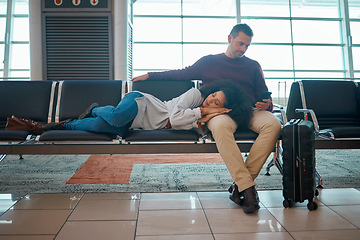 Image showing Airport, sleeping woman and couple waiting for airplane for holiday travel together.Tired, flight delay and luggage of people going on a international vacation journey with suitcase on a chair